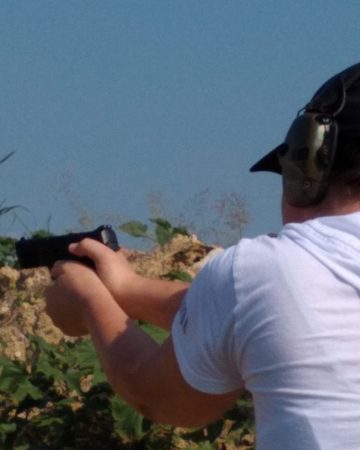 woman preparing to fire a handgun