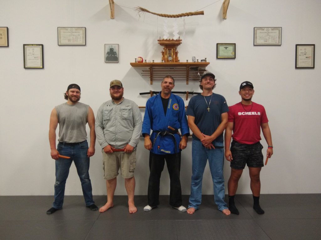 group of young men taking a defensive knife seminar
