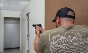 A man taking a handgun training course at Urban Defense Academy in Liberty Hill Texas. He is learning to search and clear an area, such as a home for home defense purposes.