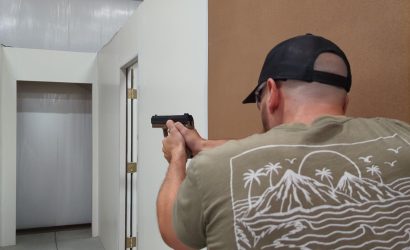 A man taking a handgun training course at Urban Defense Academy in Liberty Hill Texas. He is learning to search and clear an area, such as a home for home defense purposes.