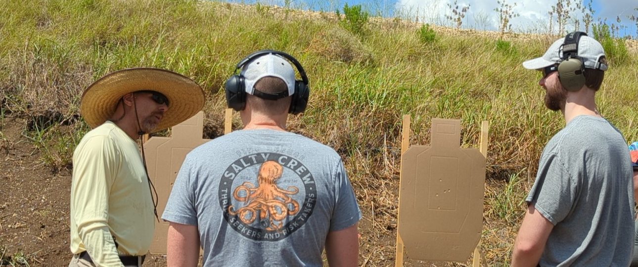 _20250708_163630 - Armed Self Defense Firearms Training Instructor and two male students analyzing targets in a firearms training class at Urban Defense Academy in Liberty Hill Texas