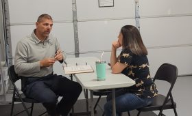 Instructor talking to woman at Free Consultation for handgun training