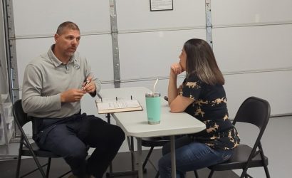 Instructor talking to woman at Free Consultation for handgun training