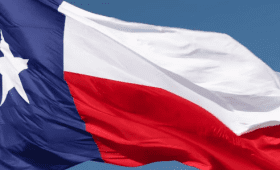 Photo of Texas Flag billowing in the wind